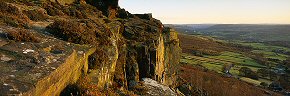 climbers on curbar edge, derbyshire